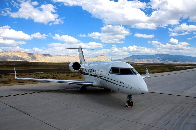 Challenger jet parked before an accessible private charter from Boca Raton, Florida