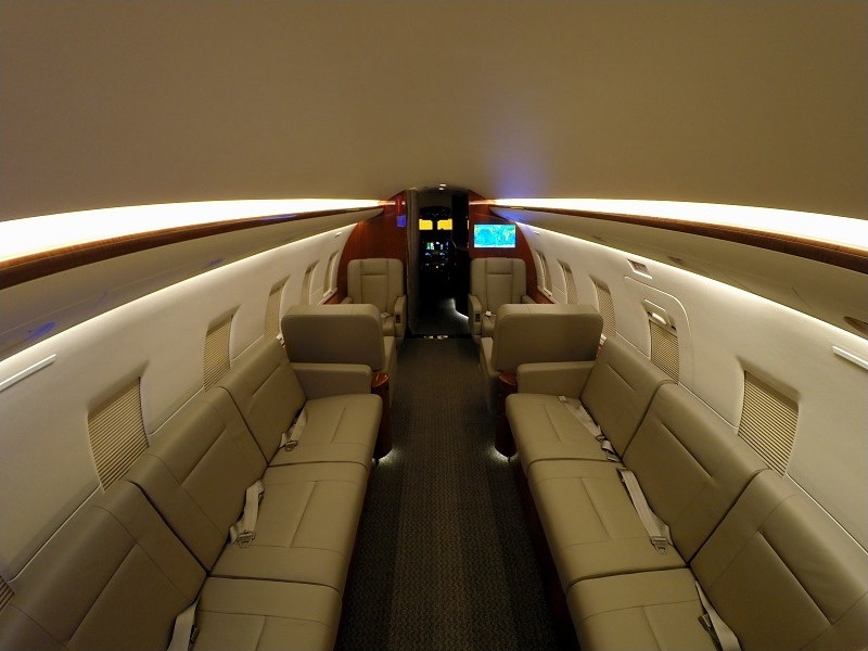 Private jet cabin looking forward through the seat rows on a Boca Raton, Florida charter