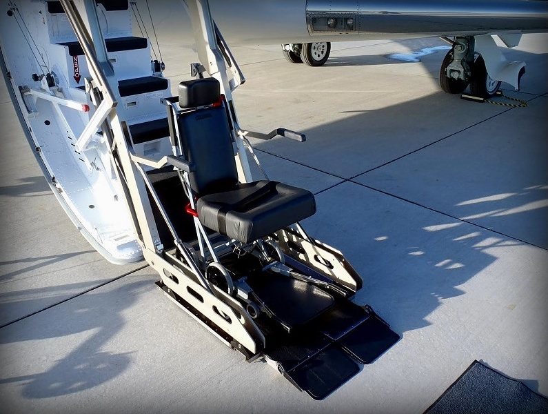 Wheelchair lift platform at the airstair door of a private jet in Boca Raton, Florida